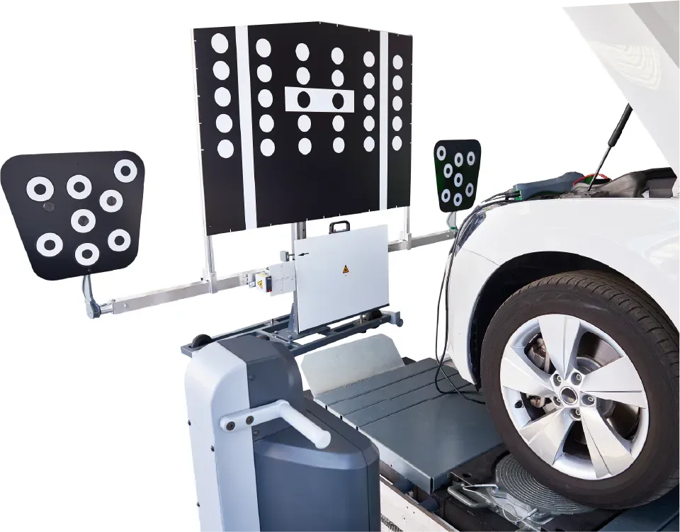 Electrician inspecting electrical panel, holding tablet, wearing hard hat and safety glasses.