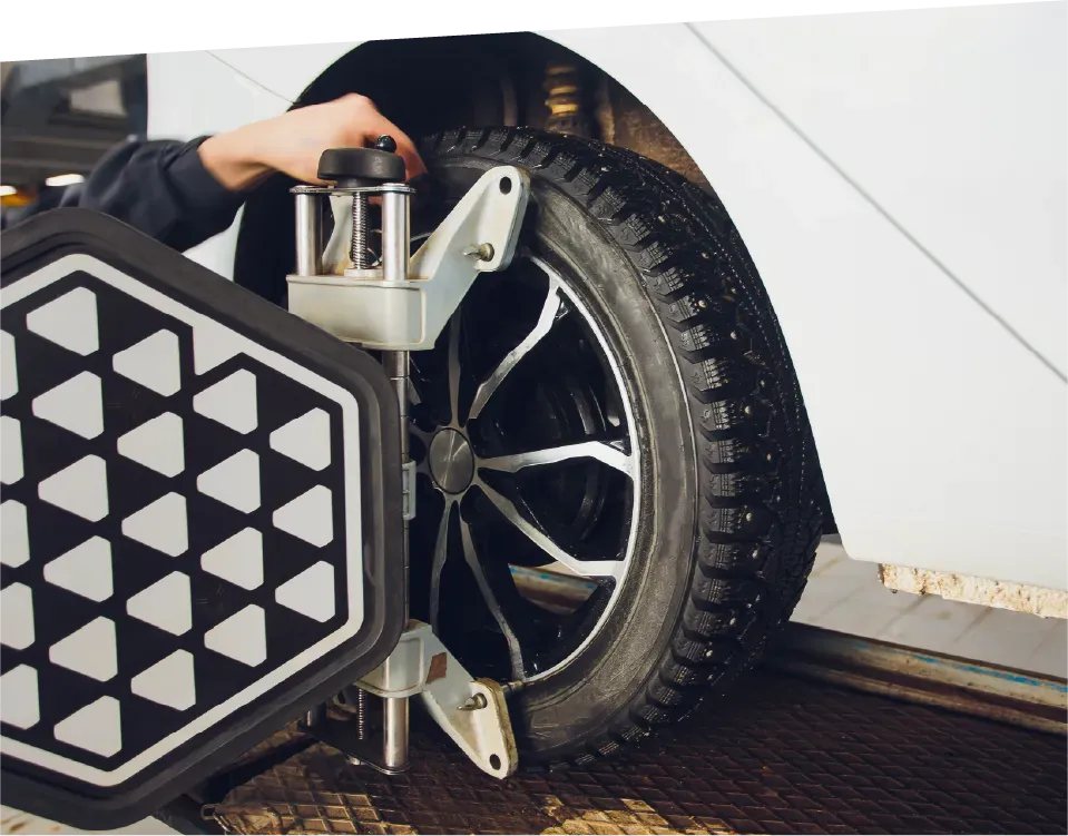 Hands of an electrician wiring a light switch, with visible colored wires and a wall outlet box.