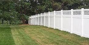 white vinyl fence along side of property