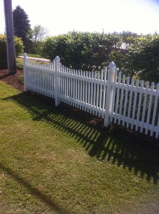 Short vinyl fence along landscaping
