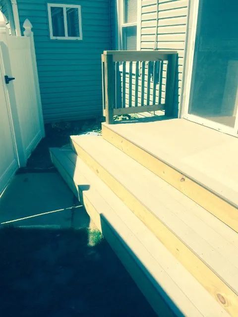 wood deck installation off backyard door