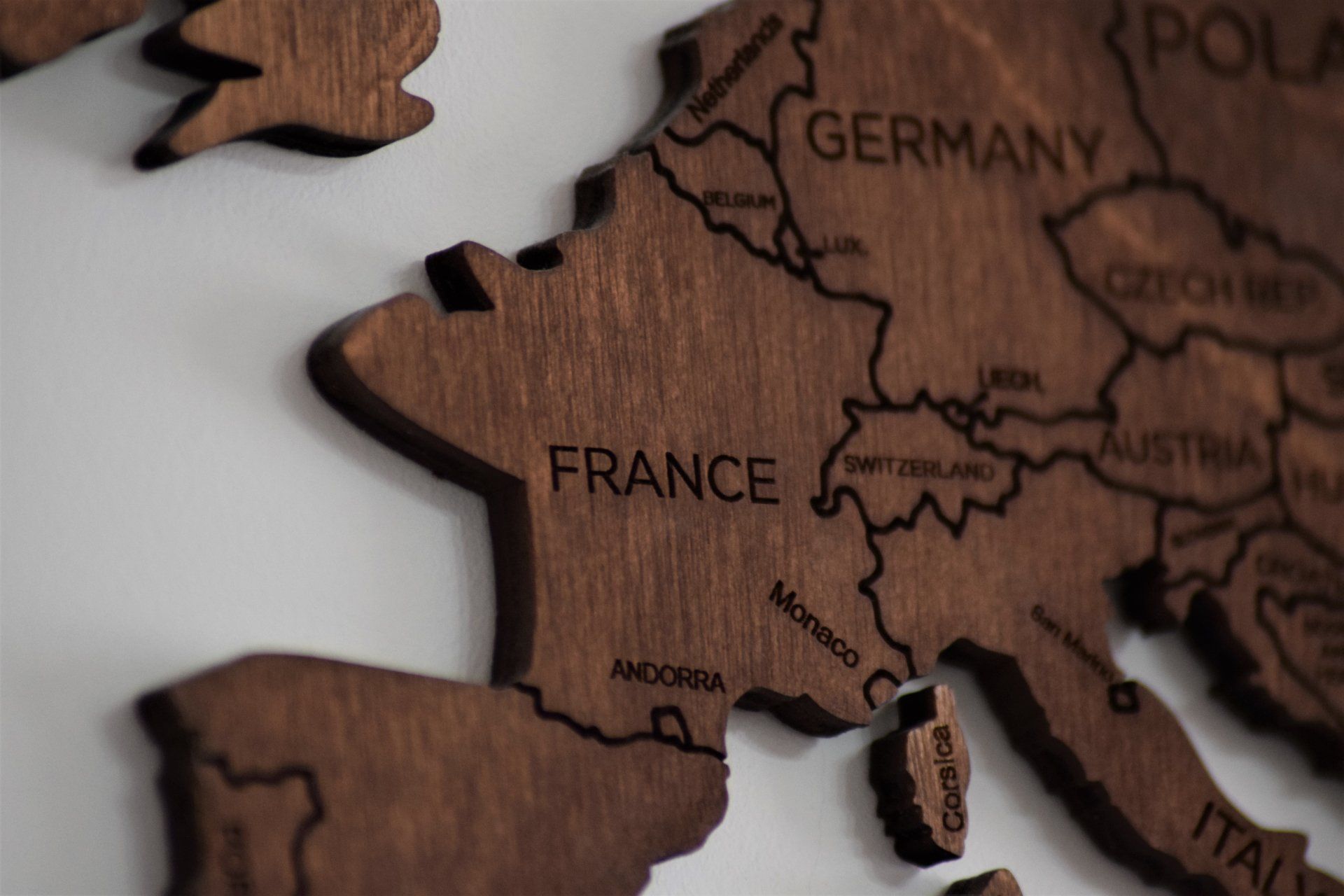 Photo by Anthony Beck A wooden map of europe with the word france on it