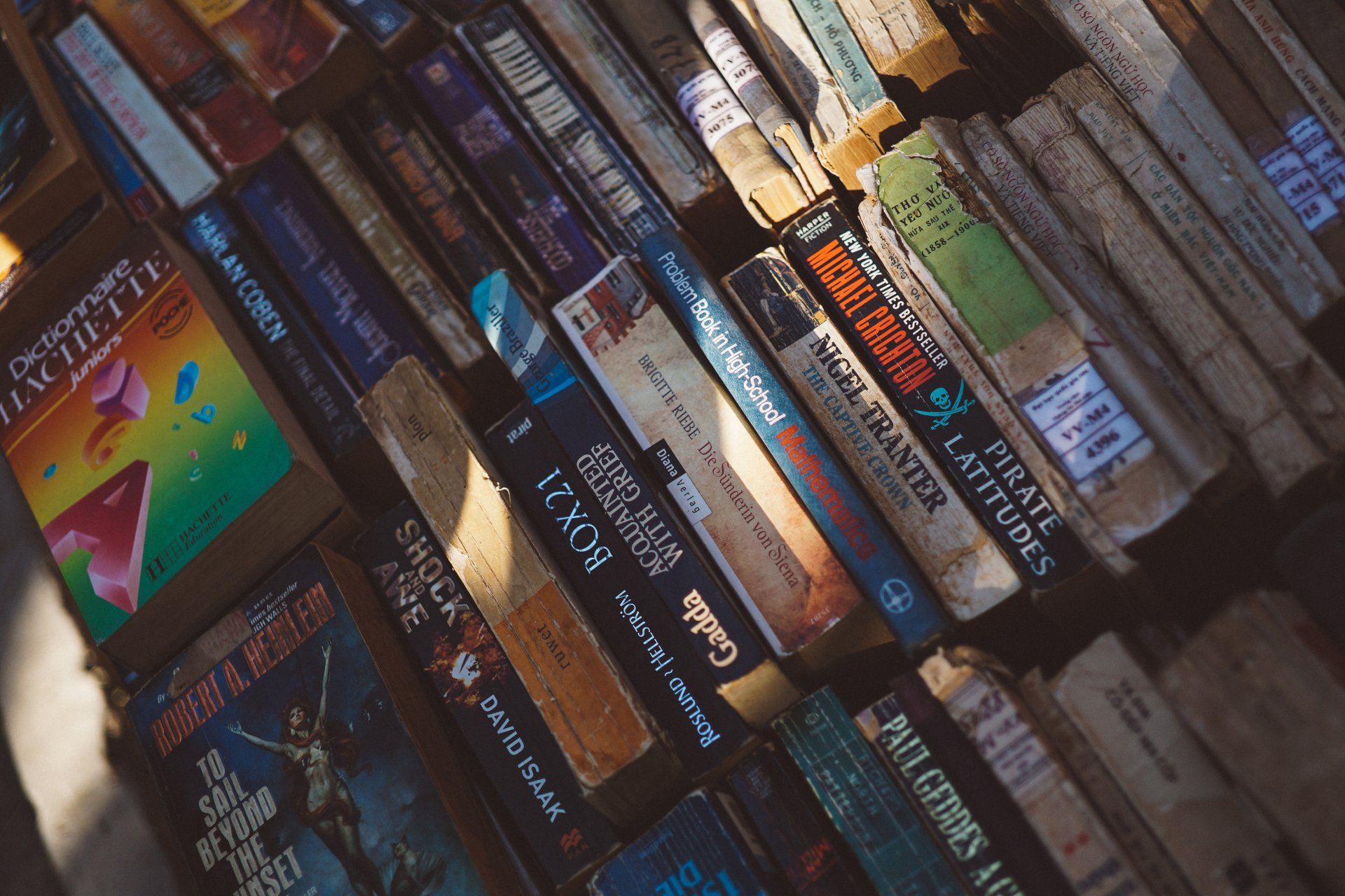 Photo by FOX A bunch of books are stacked on top of each other on a shelf.