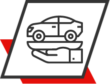 Um carro em cima de uma caixa com detalhes em vermelho.