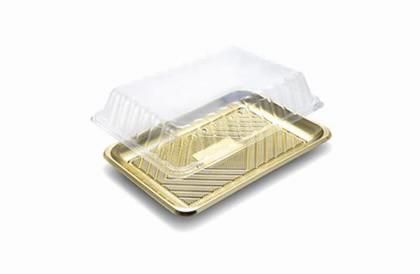 Contenitore a conchiglia in plastica trasparente su un vassoio dorato, parzialmente aperto.