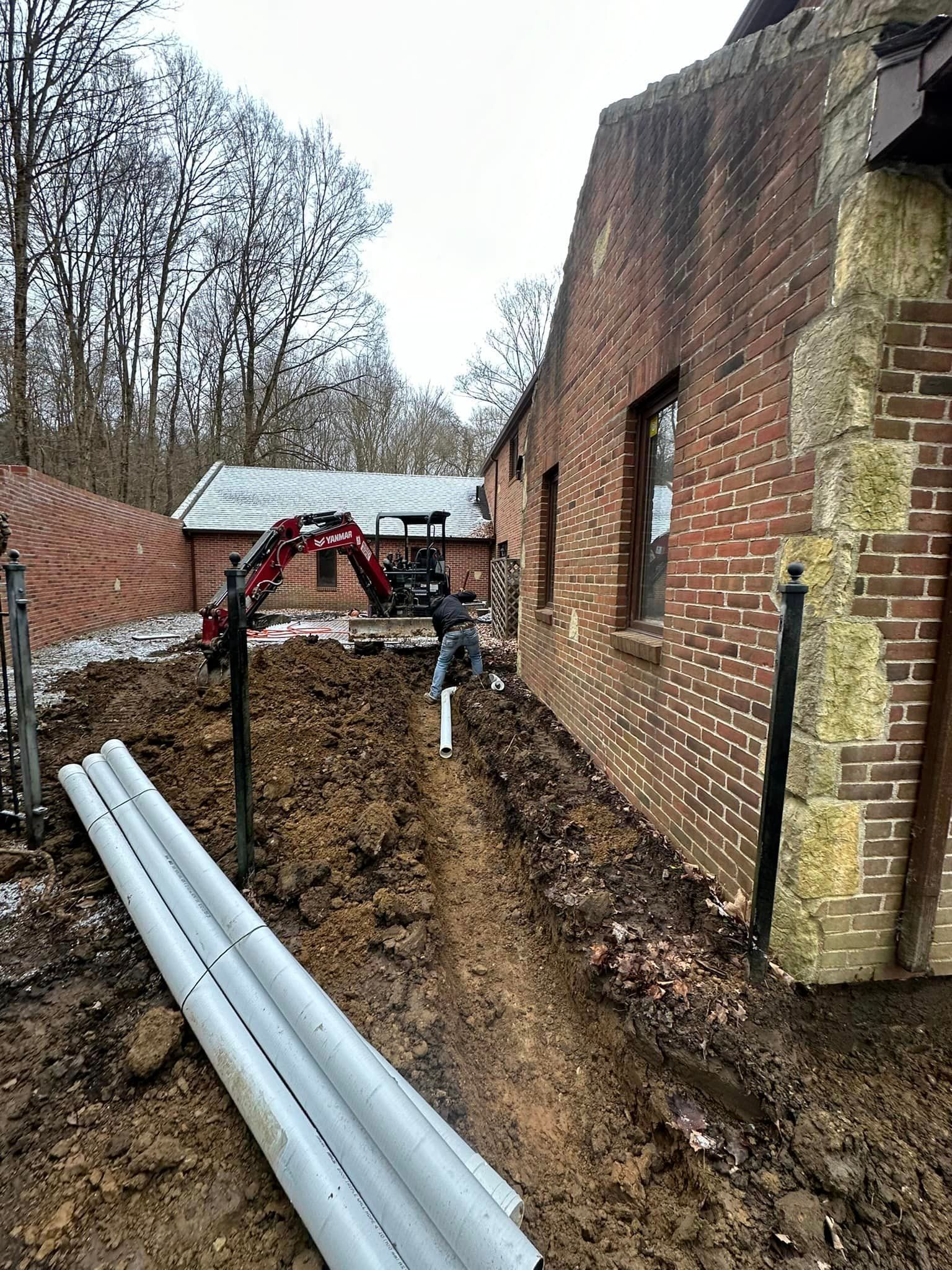 a brick building with a lot of pipes in front of it .