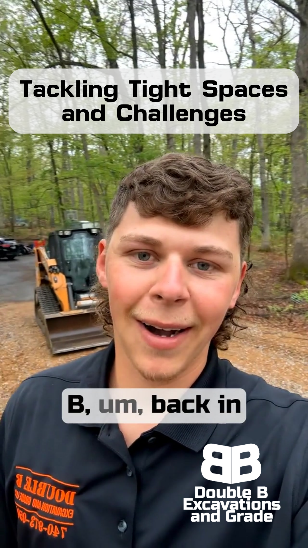 A man is standing in front of a bulldozer in the woods.
