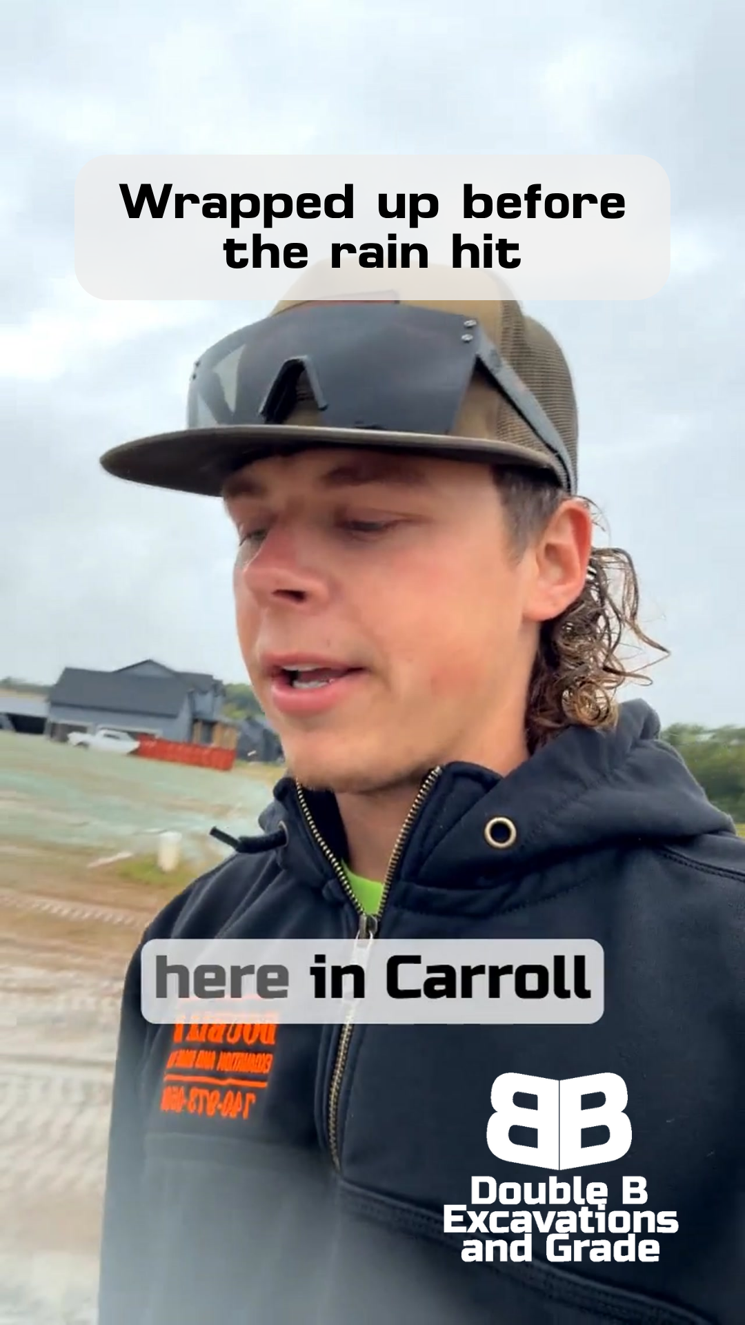 Man in cap and hoodie in Carroll, stands in the rain, with