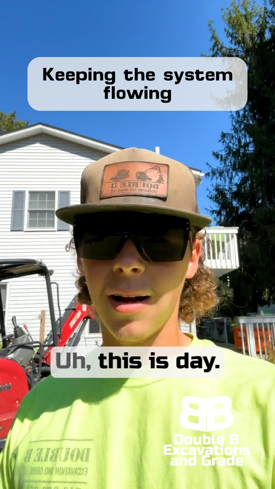 Man in sunglasses and hat, in front of a house, talking about keeping a system flowing, with a tractor in the background.