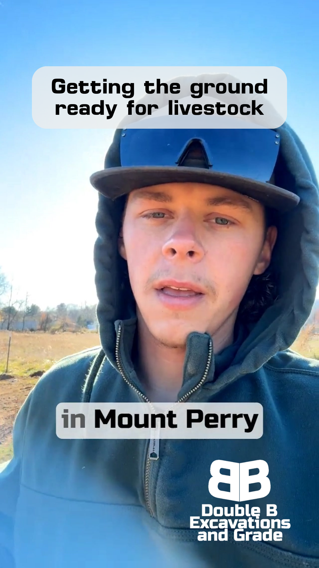 Man in a hoodie stands outside, text overlay