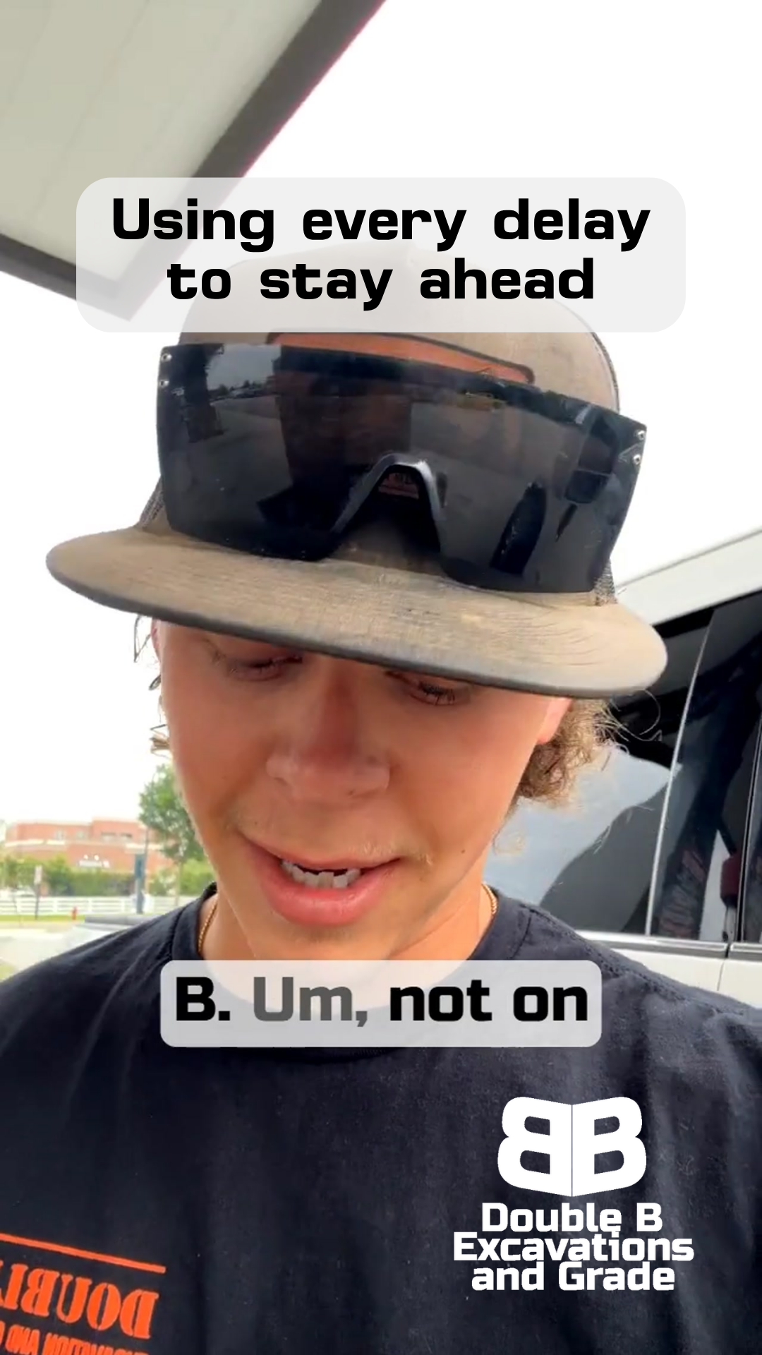 A man wearing a hat and sunglasses says