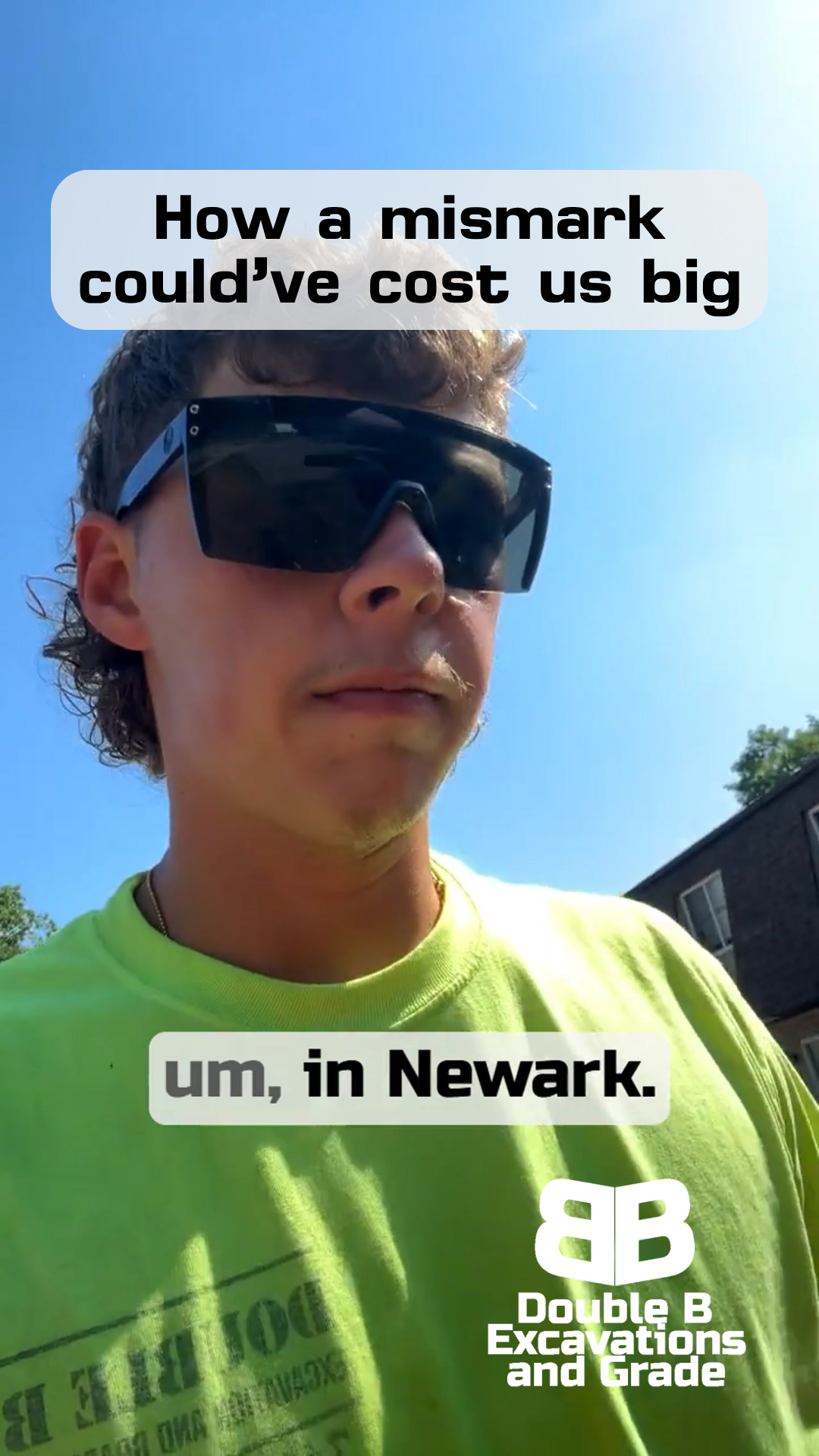 A man wearing sunglasses and a green shirt is standing in newark
