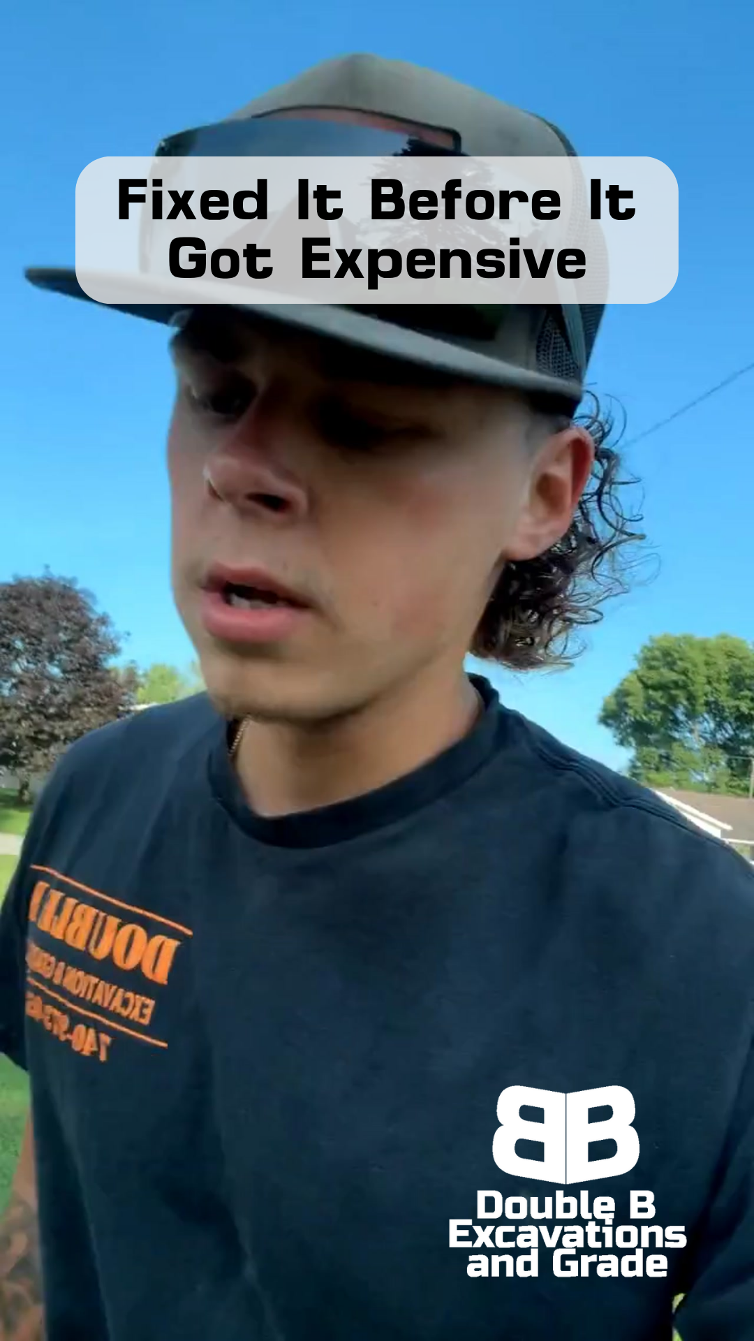 A man wearing a hat and a t-shirt that says double b excavations and grade