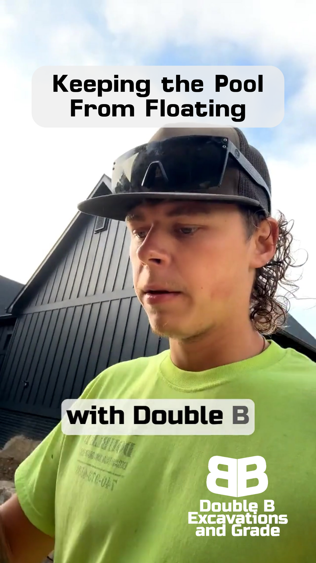 Man in green shirt, sunglasses, and cap near a black building. Text: