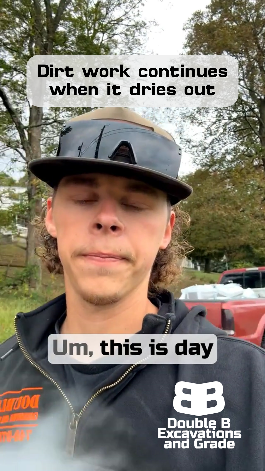 Man in a cap, steam rising from his mouth, says 
