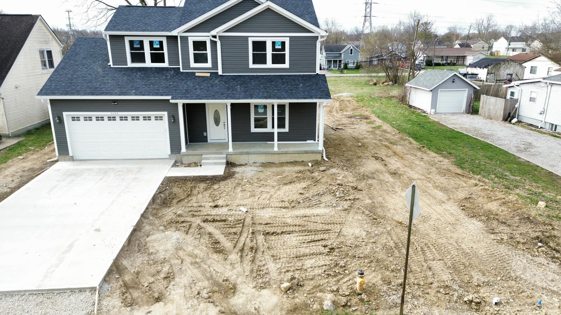 An aerial view of a house that is being built in a small town.