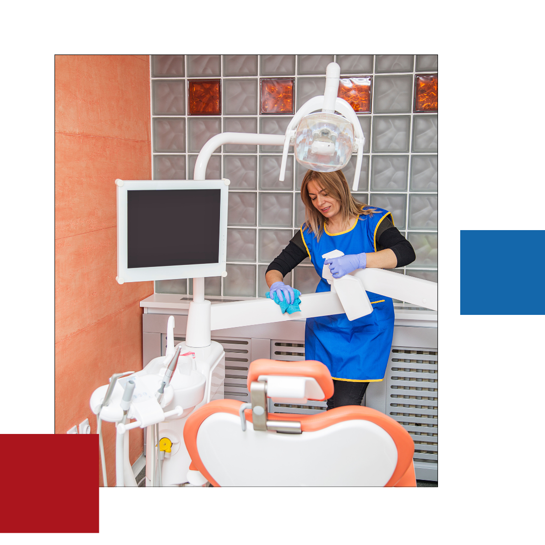 A woman is cleaning a dental chair in a dental office