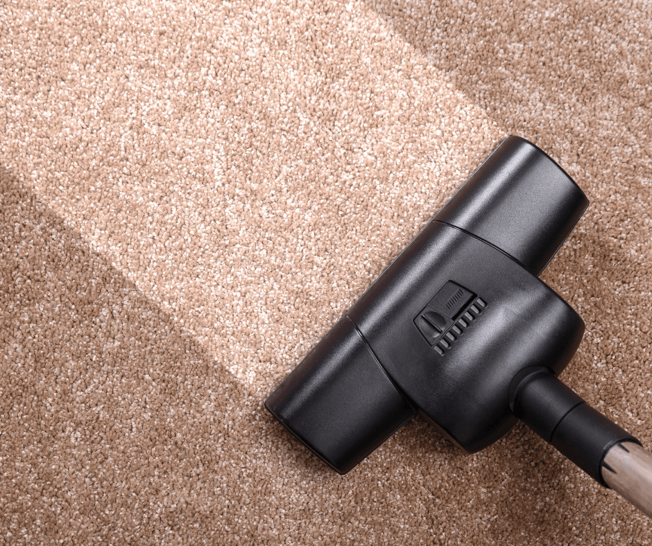 Vacuuming brown carpet