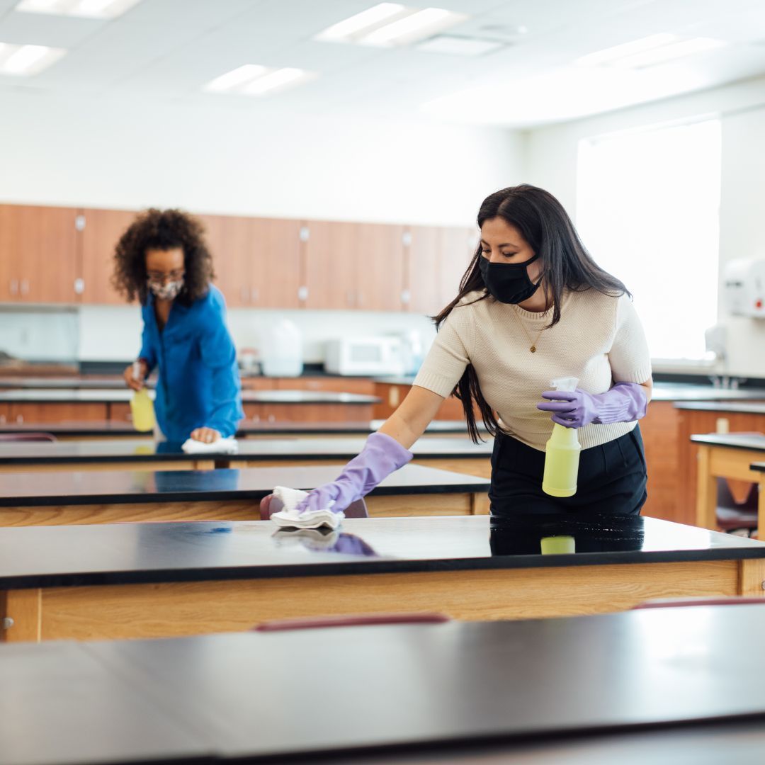 Teachers cleaning a classroom