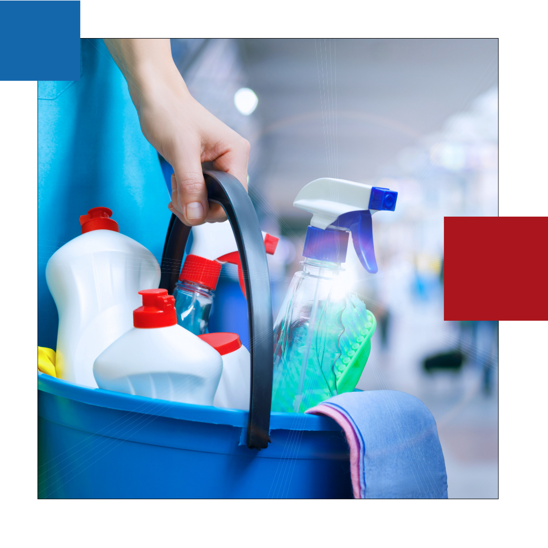 A person is holding a blue bucket filled with cleaning supplies.