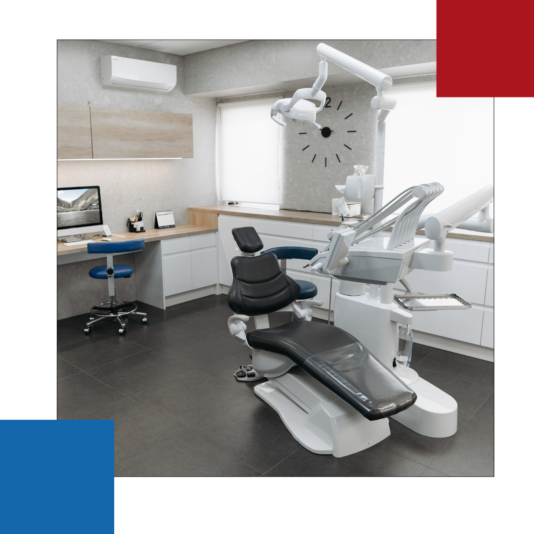 A dental office with a clock on the wall and a dental chair.