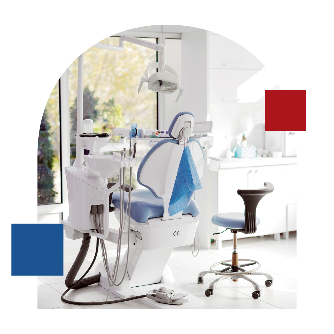 A blue and white dental chair is in a dental office.