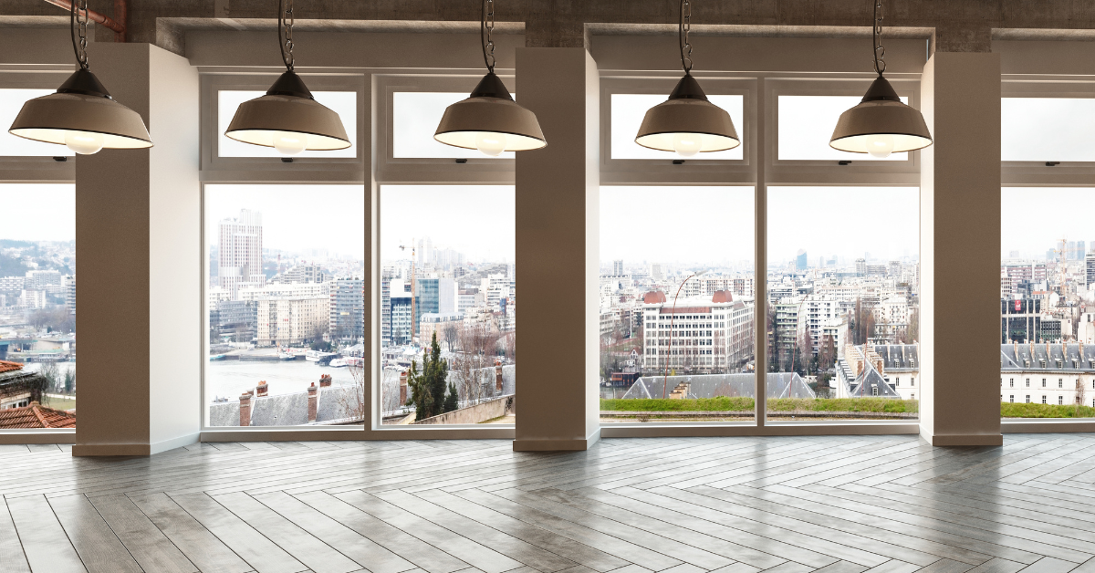 A large room with lights and large window