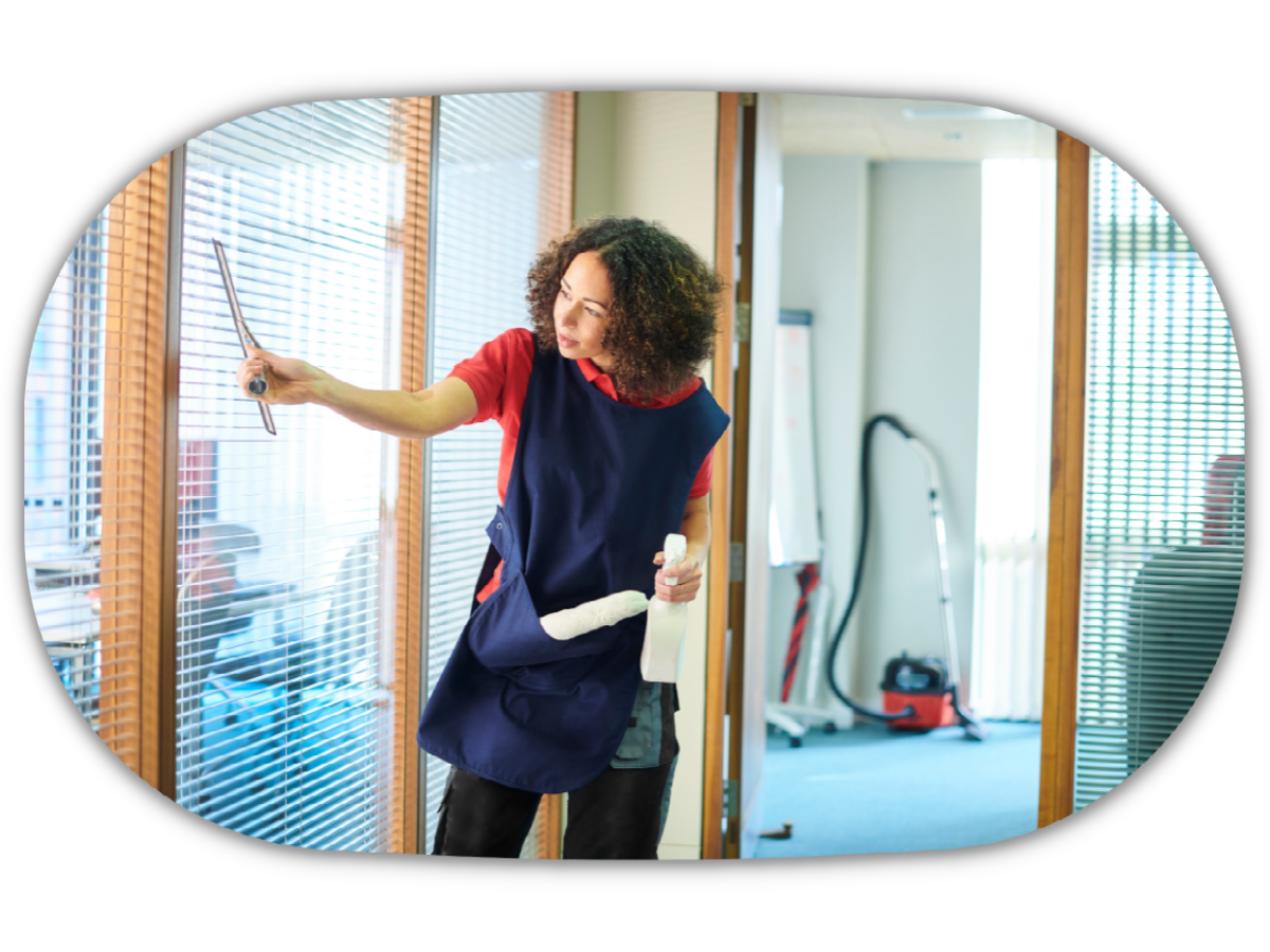 office cleaner wiping the windows