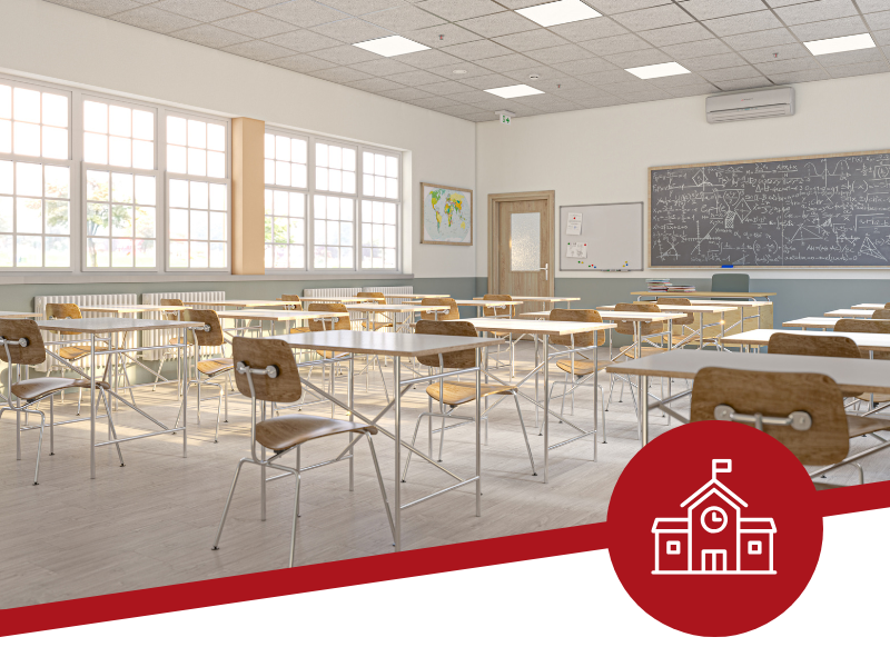 An empty classroom with tables and chairs and an icon of a school building.