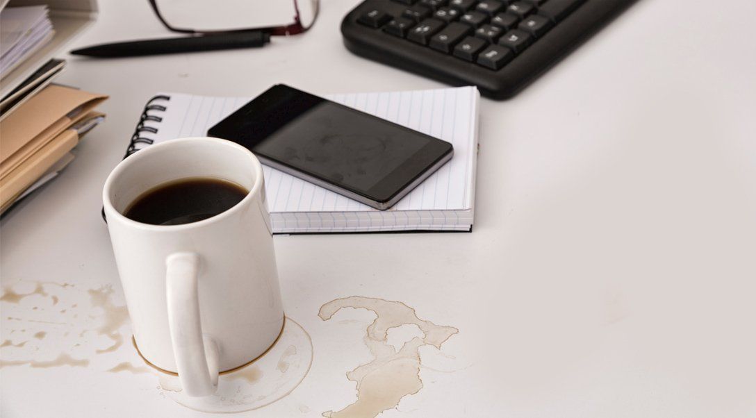 Spilt coffee on work desk