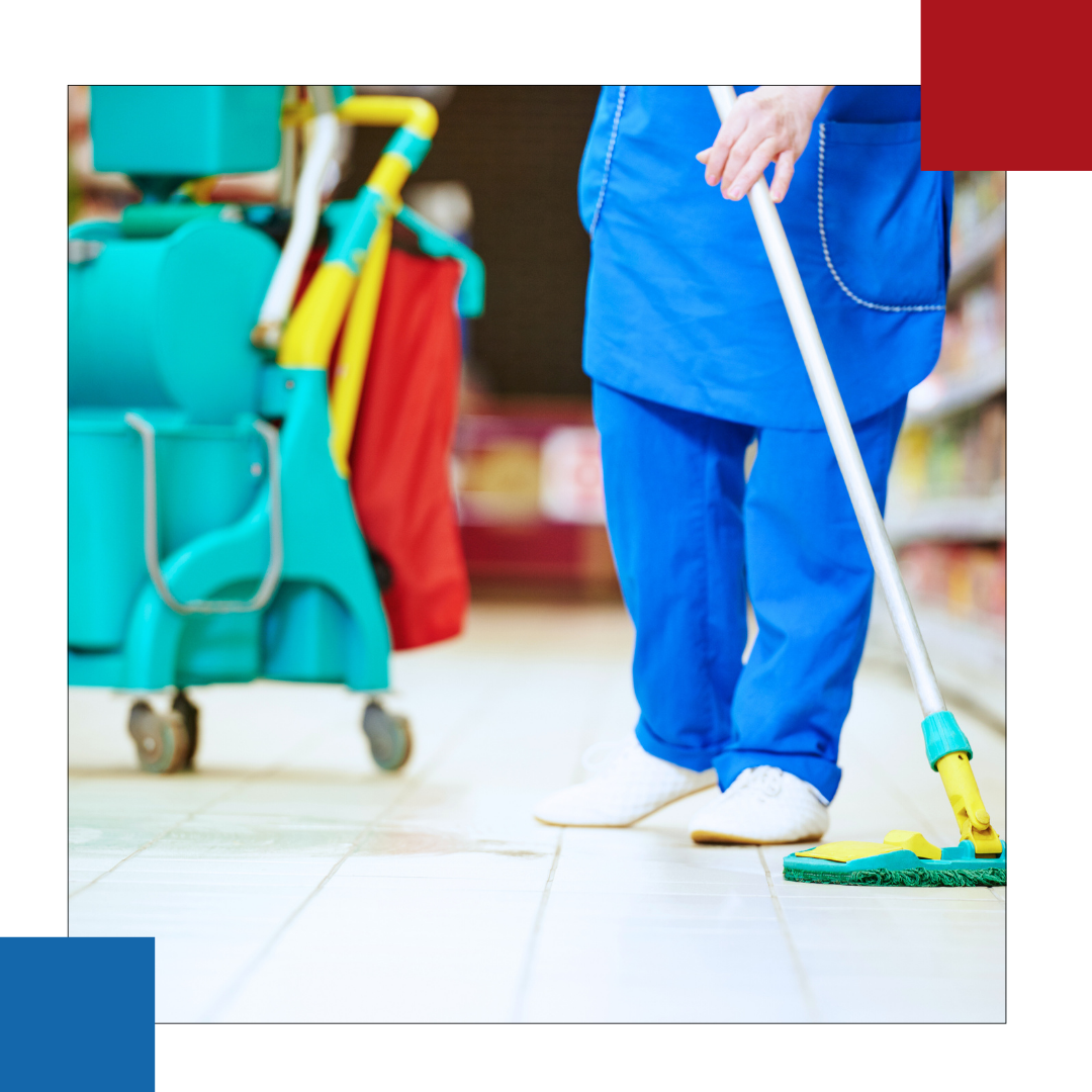 A person cleaning a floor with a mop in a store
