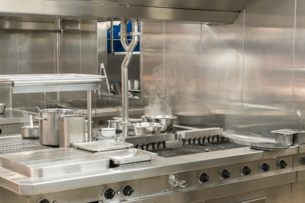 A large stainless commercial kitchen for janitorial services
