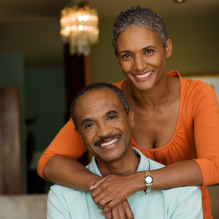 Smiling, home owners