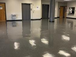 a photo of clean floor of a wide office