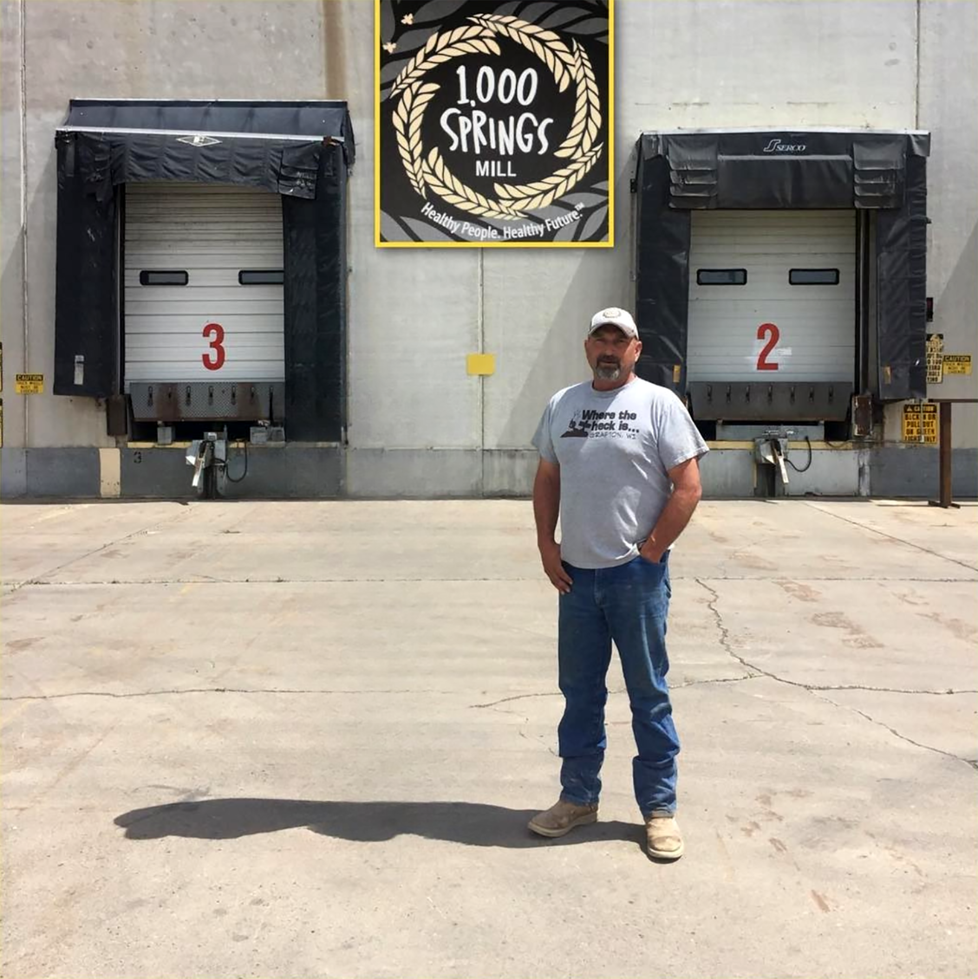 Tim standing outside of the warehouse near the loading docks