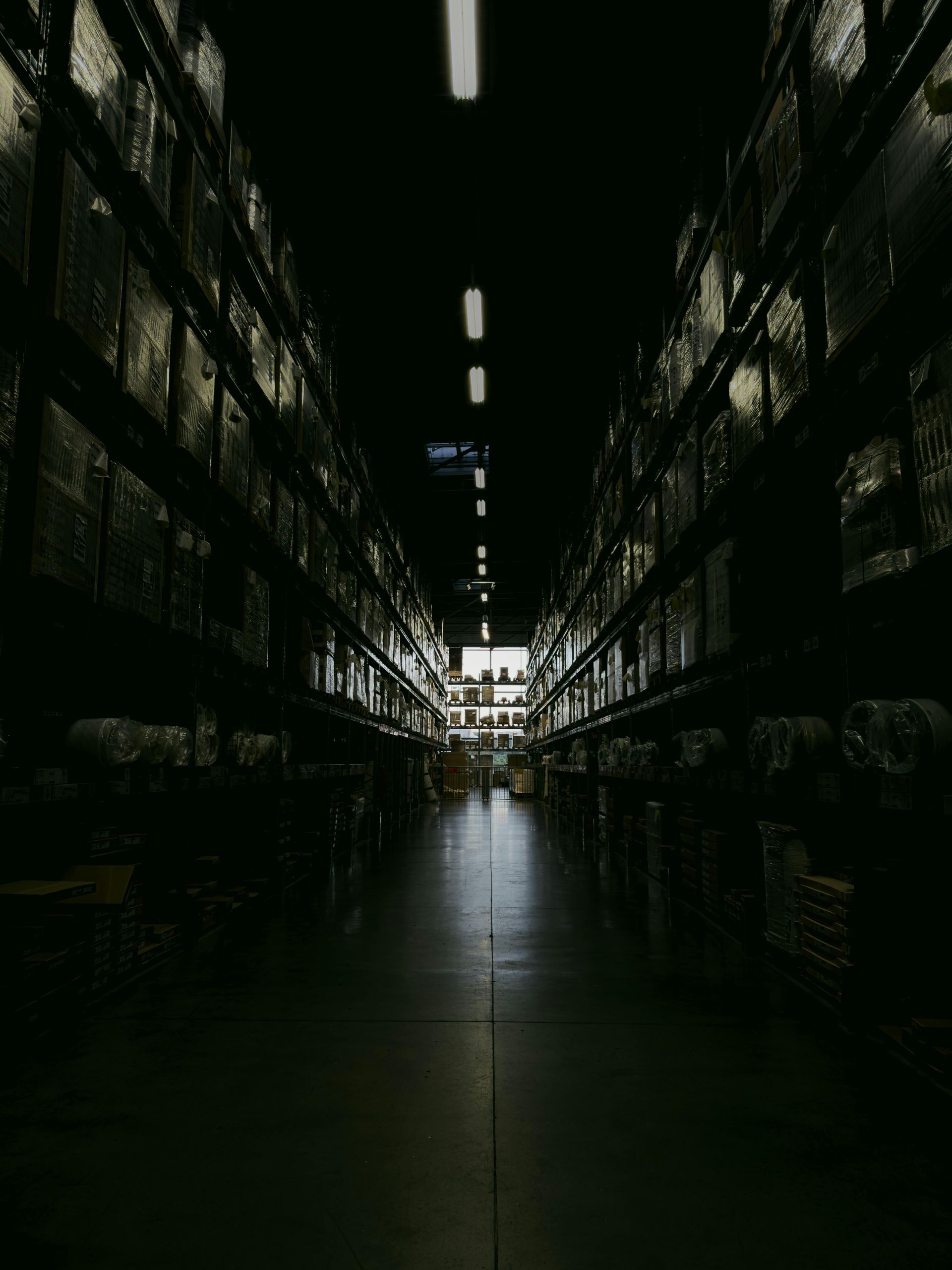 darkened row of a large warehouse