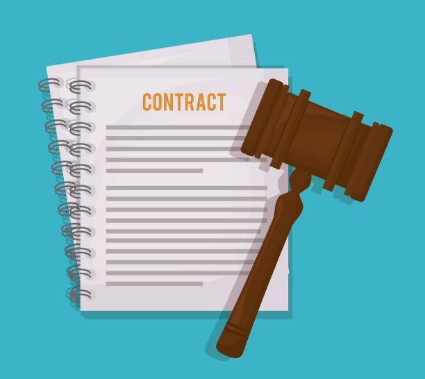 A wooden judge 's gavel is sitting on top of a contract.