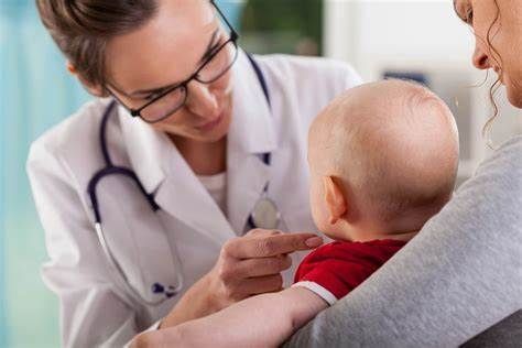 The compassionate nurse gently cradled the baby, soothing them with a soft lullaby.