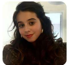 Young woman with dark hair, red lipstick, and gold hoop earrings smiles at the camera.