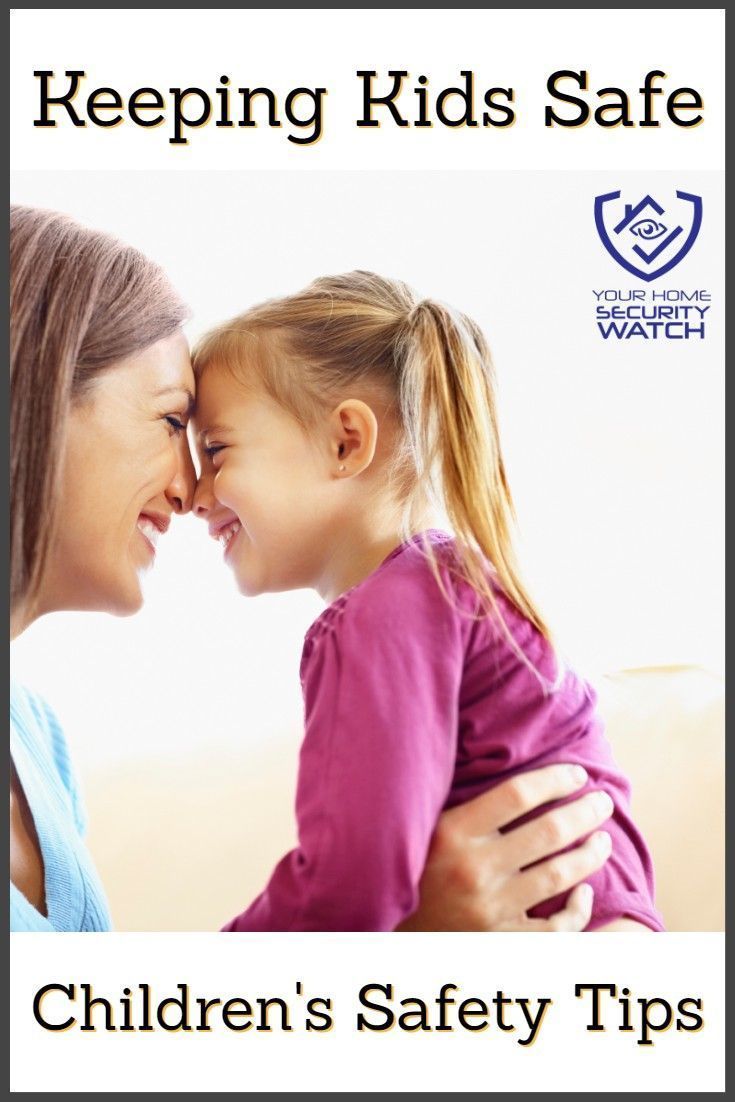 A woman is holding a little girl in her arms.