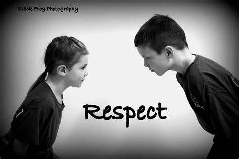 A boy and a girl are standing next to each other and looking at each other.