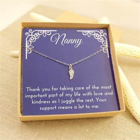 A nanny necklace in a box with a thank you card.