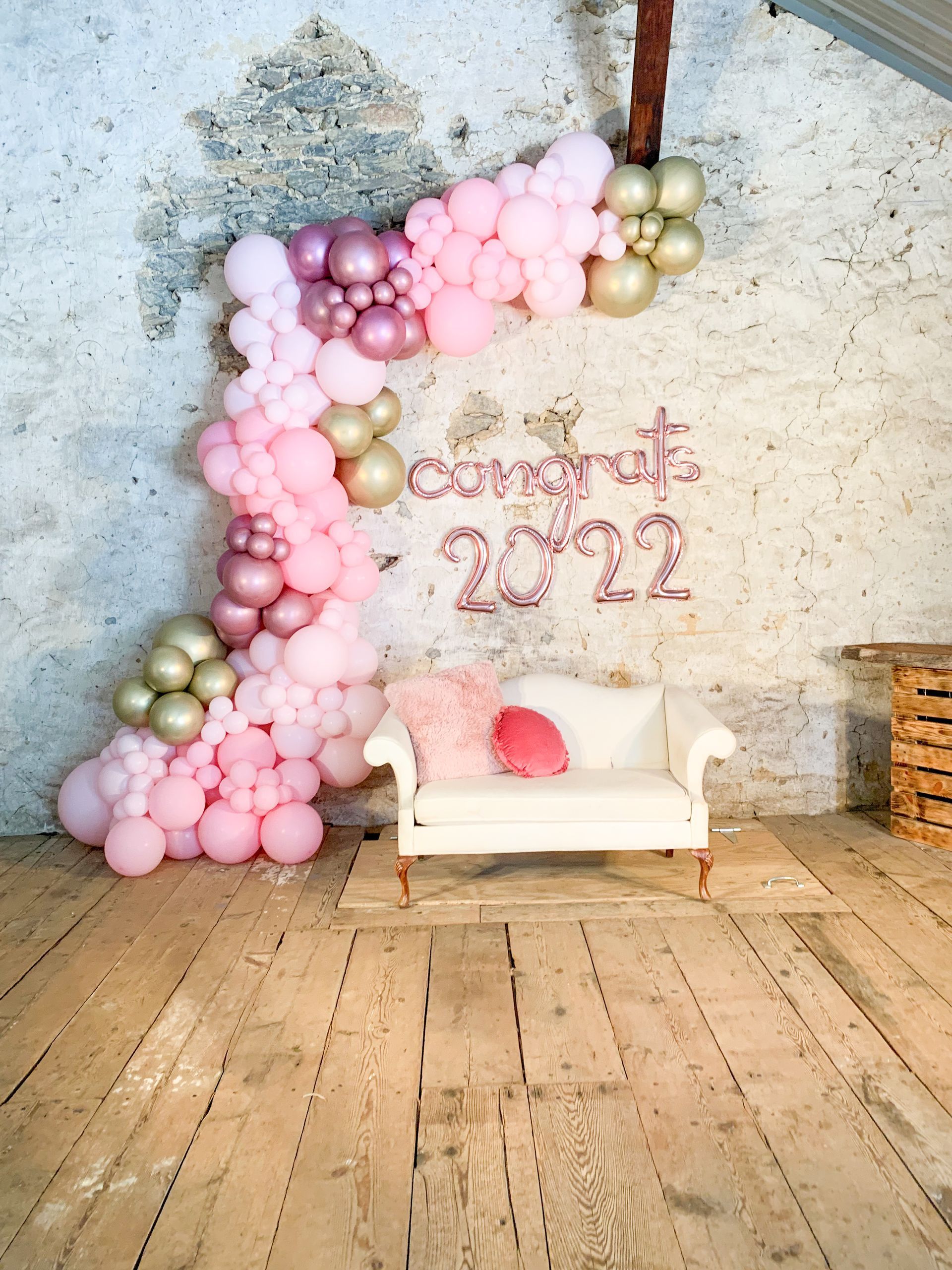 Pink and gold balloon arch,