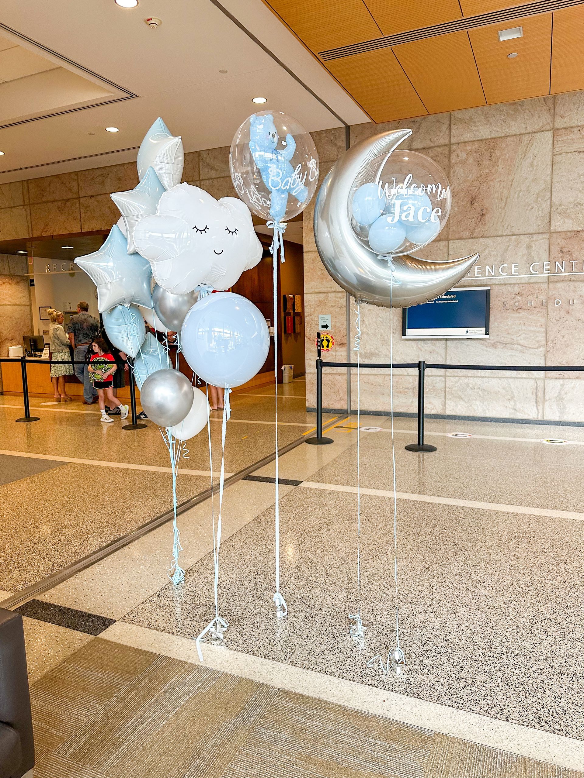 Helium balloons for a welcome baby hospital delivery. Moon and cloud balloons