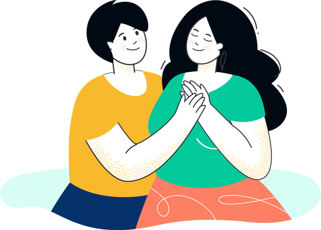 A man and a woman are sitting next to each other holding hands.