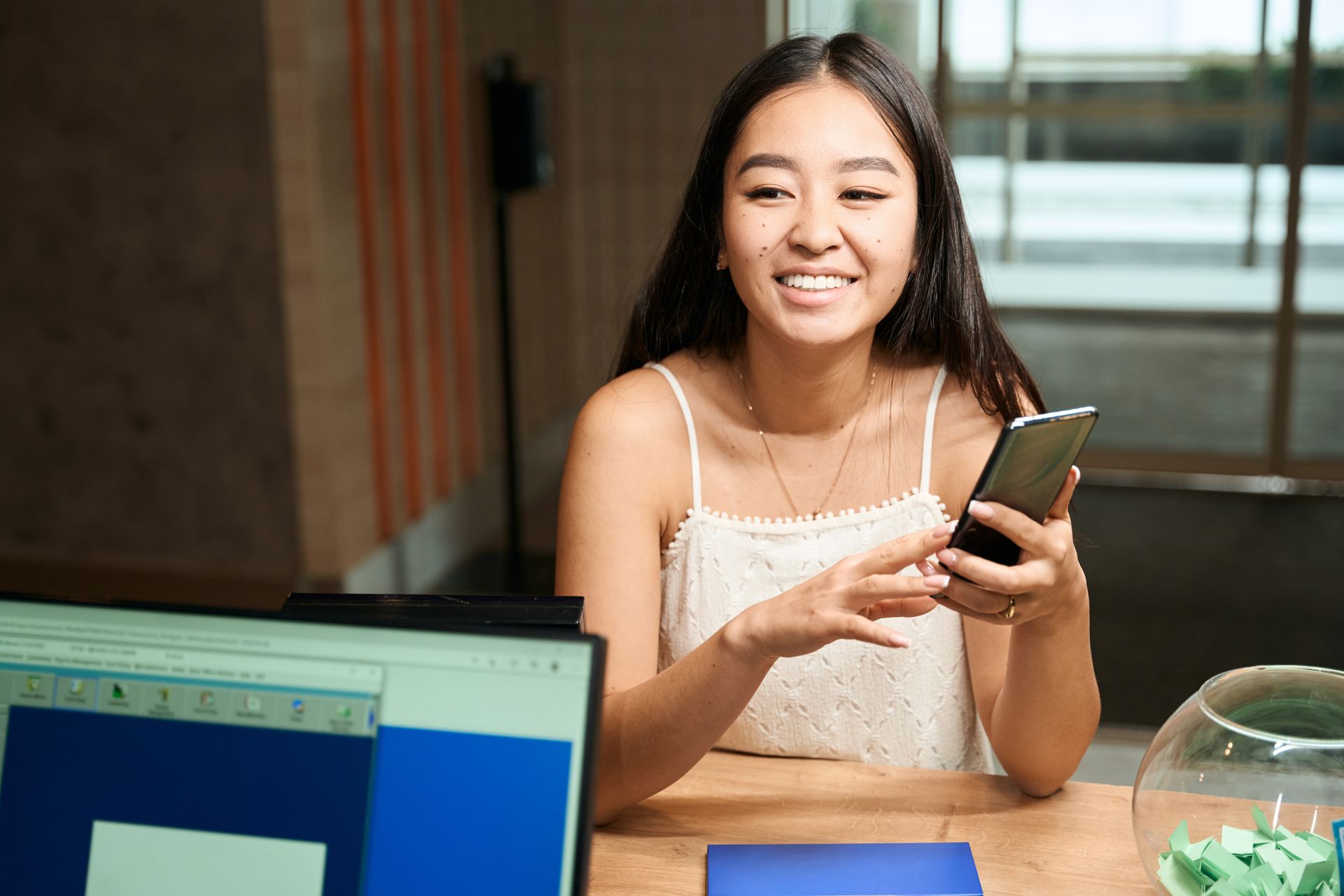 A woman is writing on a clipboard while a man wearing a mask looks on.