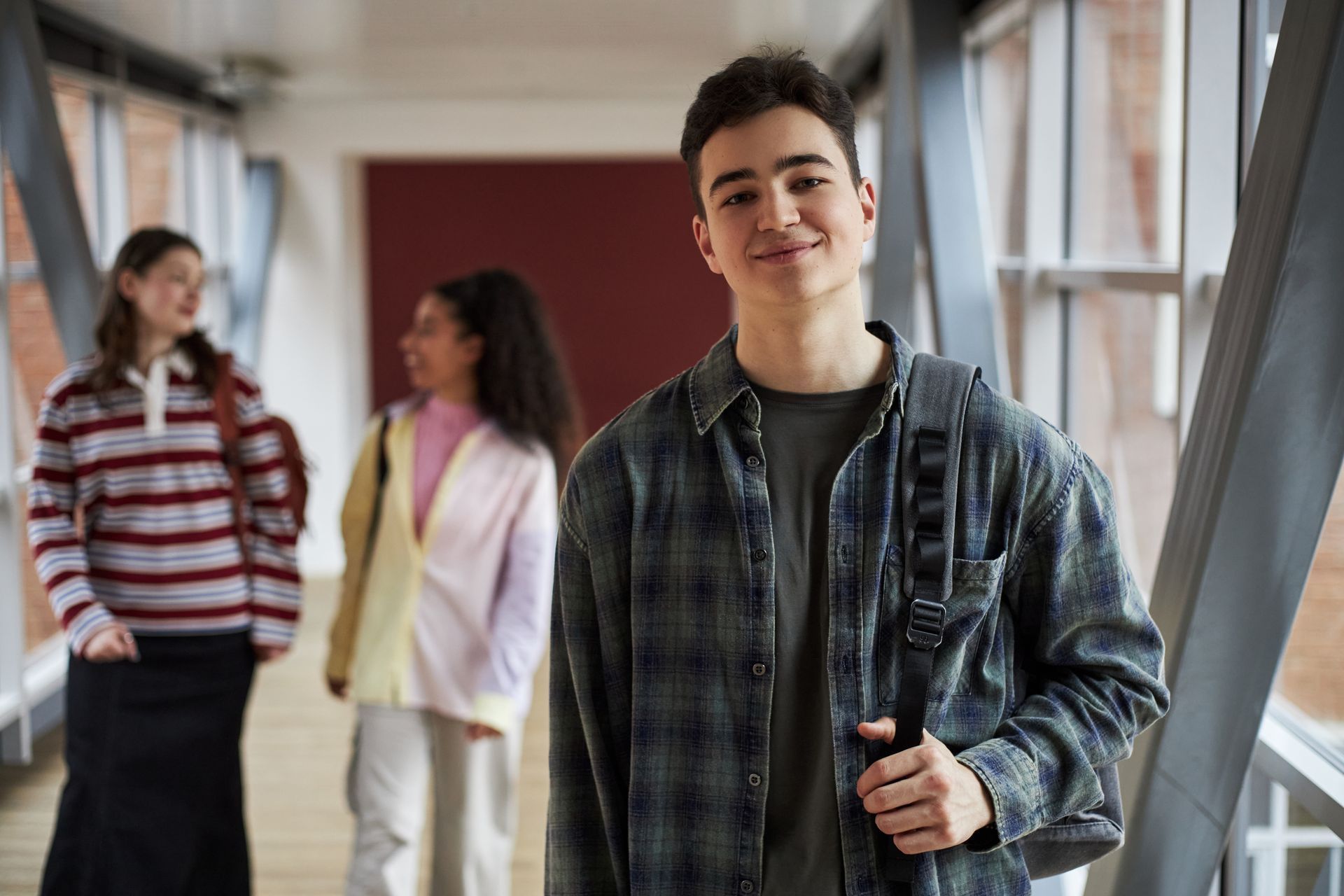 A woman is covering her face with her hands.