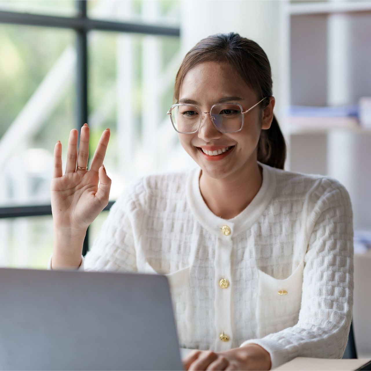A woman is writing on a clipboard while a man wearing a mask looks on.