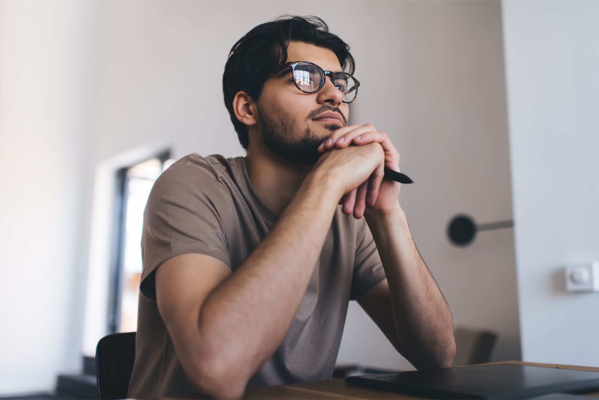 A man is carrying a woman on his back and kissing her on the cheek.