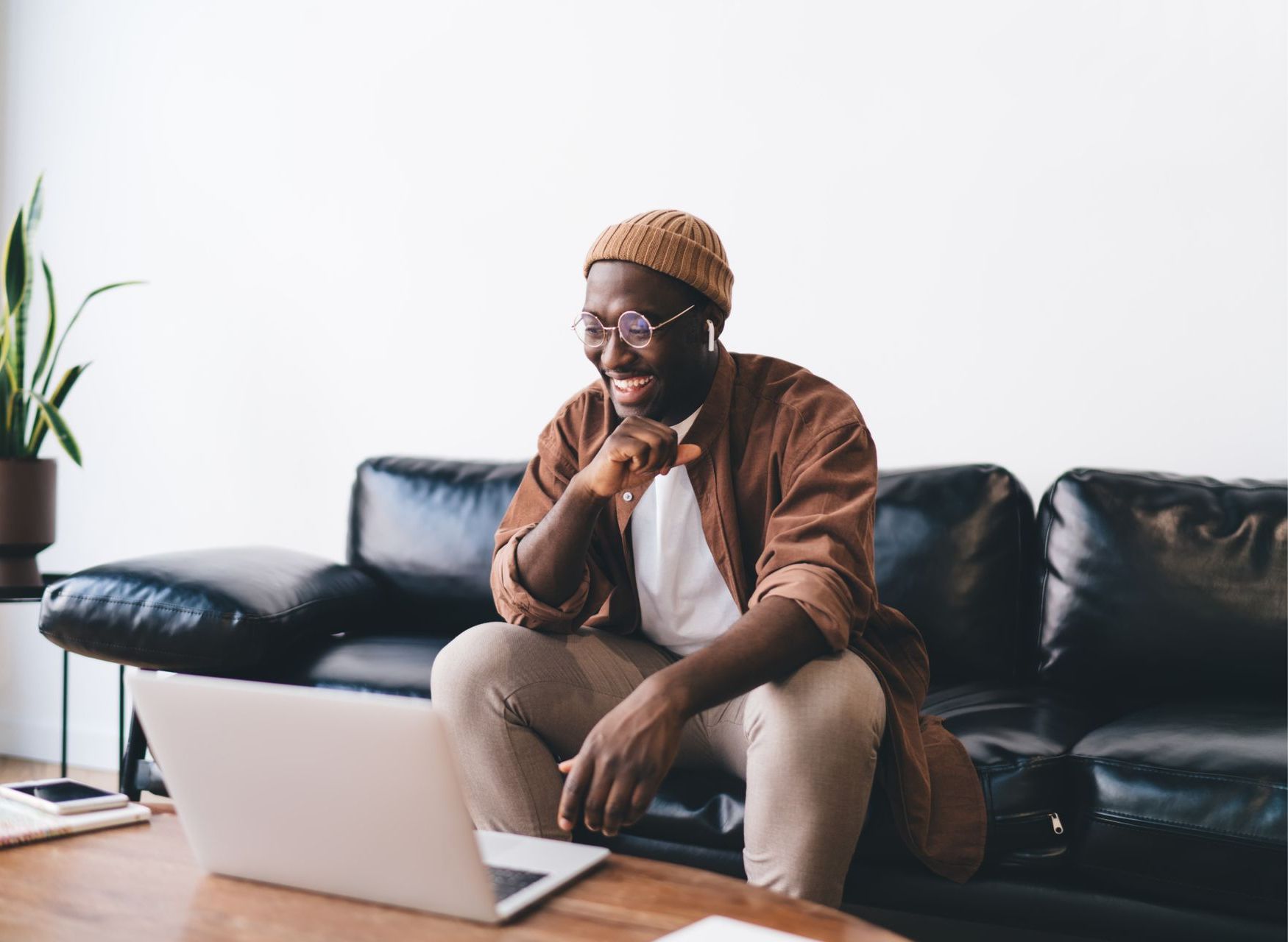 A woman is covering her face with her hands.